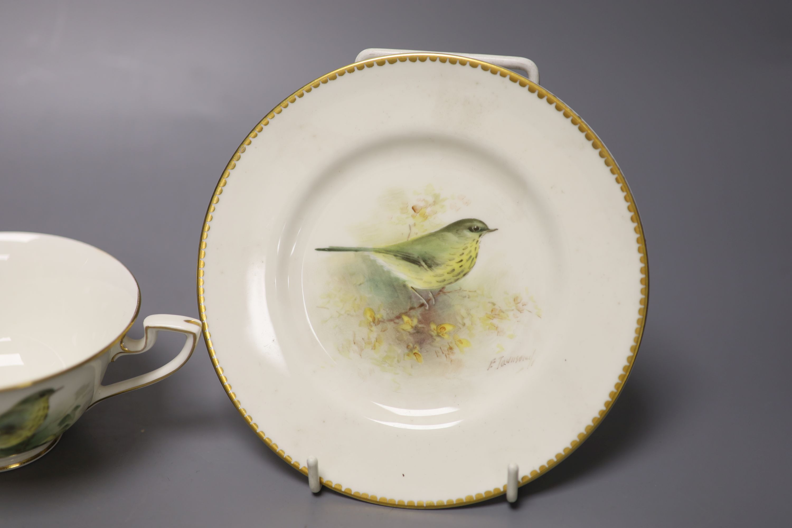 A Royal Worcester teacup, saucer and side plate, each unusually painted with a thrush on a branch by E. Townsend, signed black mark,